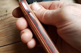 Convex ground trailing point hunter in 14C28N and Permali densified wood.